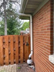 Well-integrated radon mitigation system on a home's exterior, featuring discreet venting and an unobtrusive design"